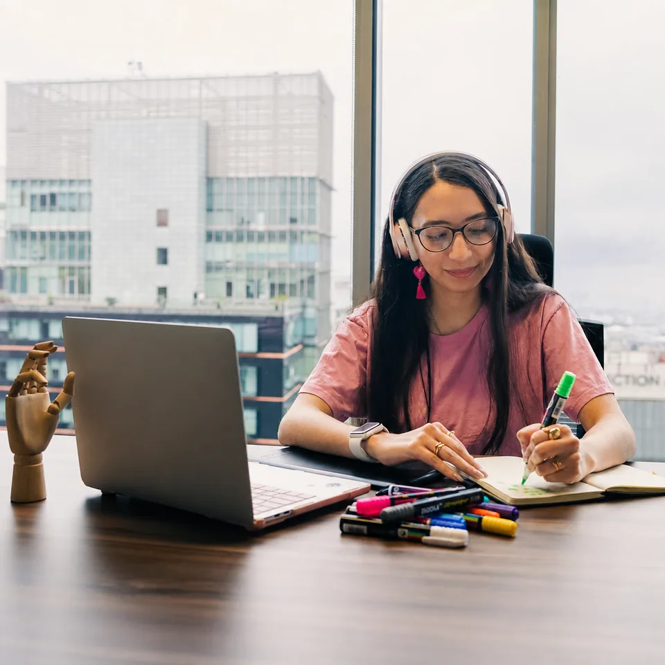 A student developing ideas at her desk
