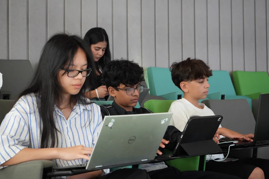 Students developing their work during a research session